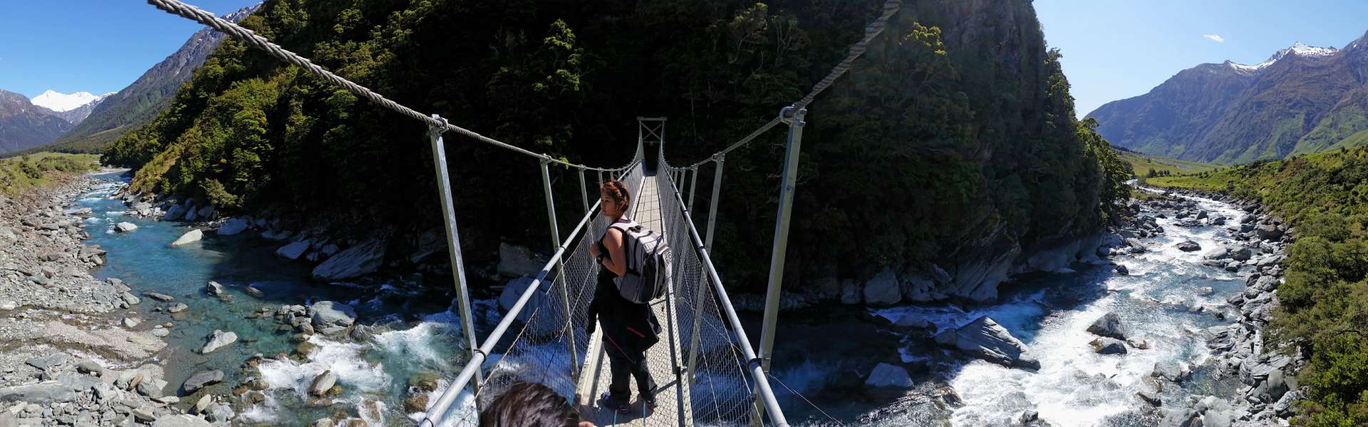 Entering Mt Aspiring National park via swing bridge